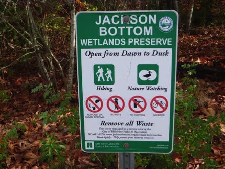 Sign – ”Jackson Bottom Wetlands Preserve, open dawn to dusk, hiking, nature walking” – no pets or bikes – remove waste